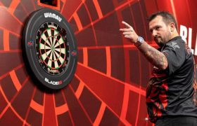 Jonny Clayton celebrates a 180 score.