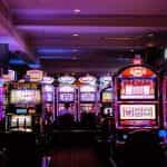 Rows of slot machines in a gaming room.