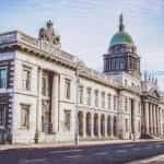 An elaborate customs house in Dublin, Ireland, featuring stone columns and a copper dome.