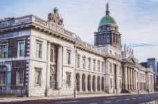 An elaborate customs house in Dublin, Ireland, featuring stone columns and a copper dome.