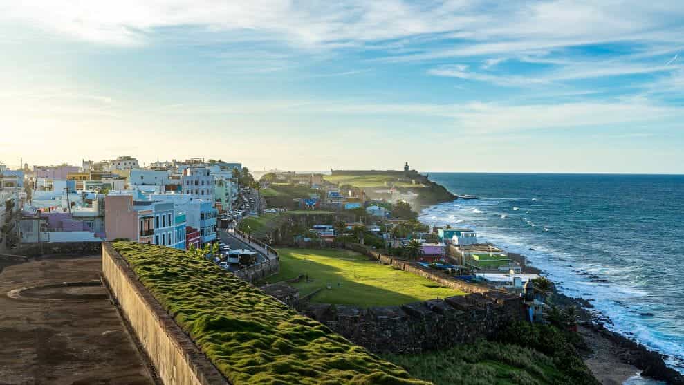 The town of San Juan, Puerto Rico on the coast at dusk.