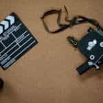 A film camera and a clapboard.