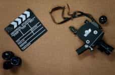 A film camera and a clapboard.