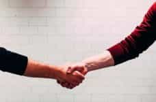 A handshake between two people.