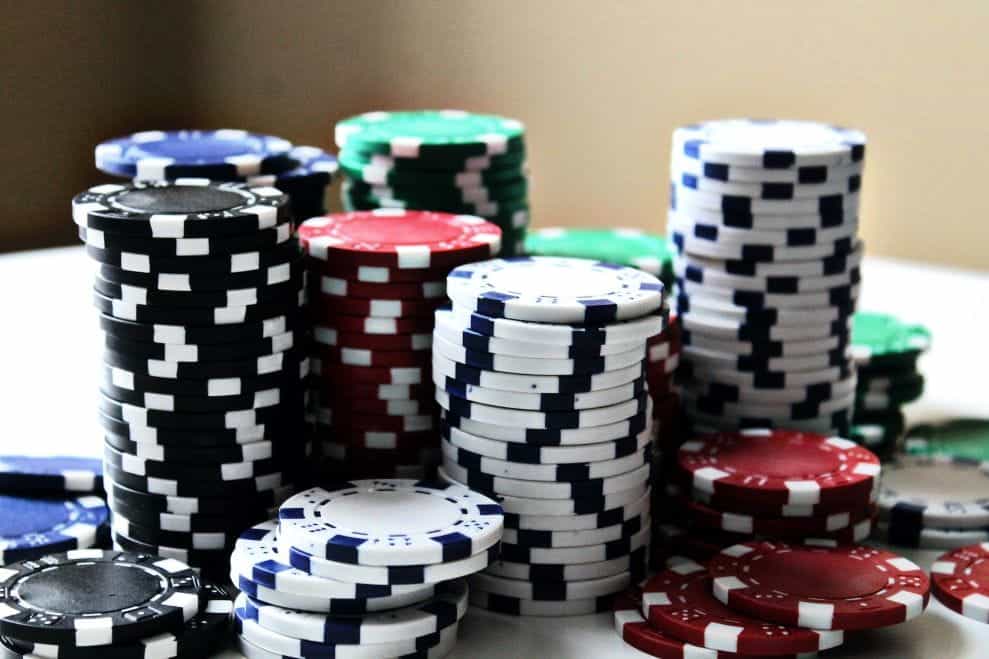 A multicolored stack of poker chips.