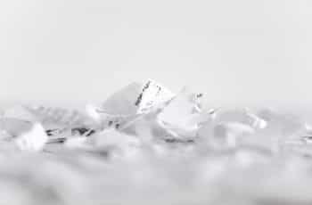 A pile of papers and paperwork crumpled and shredded up after going through a shredder machine.