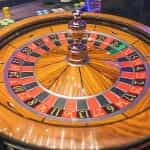 A wooden roulette wheel.