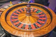 A wooden roulette wheel.