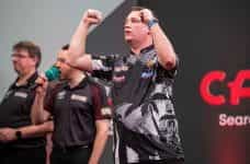 Chris Dobey at the oche during darts 2023 Masters..