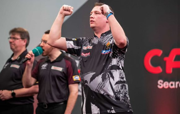 Chris Dobey at the oche during darts 2023 Masters..