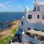 A multi-level white stucco house on the coast of Punta del Este, Uruguay.