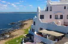 A multi-level white stucco house on the coast of Punta del Este, Uruguay.