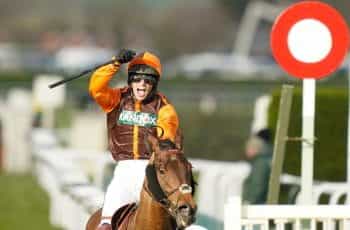 Sam Waley-Cohen celebrates after winning the 2022 Grand National aboard Noble Yeats.