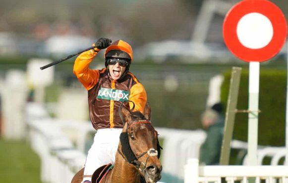 Sam Waley-Cohen celebrates after winning the 2022 Grand National aboard Noble Yeats.