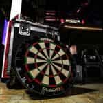 A dart board placed backstage amongst equipment at a PDC event..