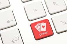 Red computer key with an aces image and the word poker written on it.