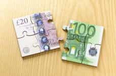 Euro and British Notes created to appear like jigsaw pieces.