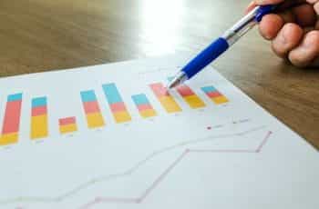 A pen pointing to a graph.