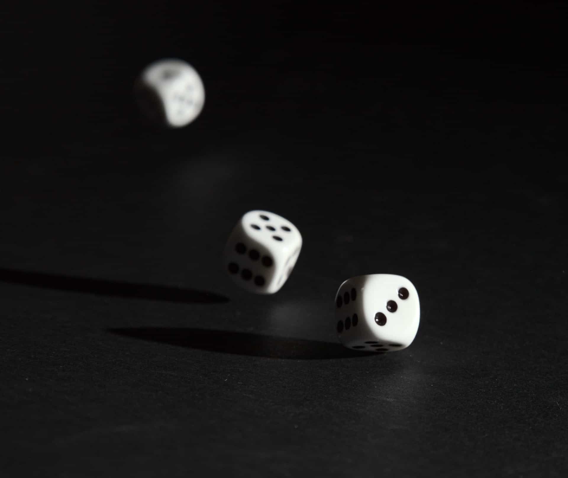 Three rolling dice.