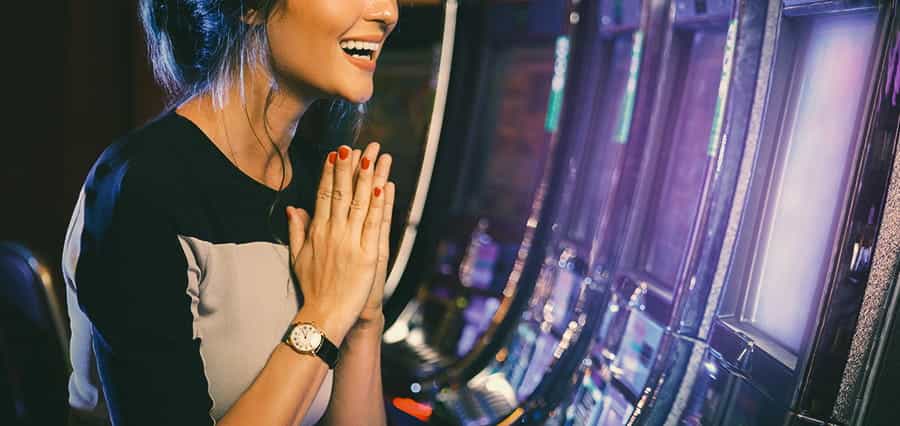 Woman playing a slot machine