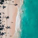 Aerial shot of the clear blue ocean beaches of Punta Cana.