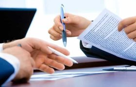 Signing contracts.