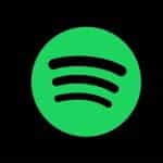 The logo of music streaming platform Spotify, featuring black soundwaves gradually increasing in size inside of a green circle.