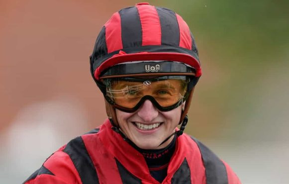 A close-up head shot of jockey, Tom Marquand.