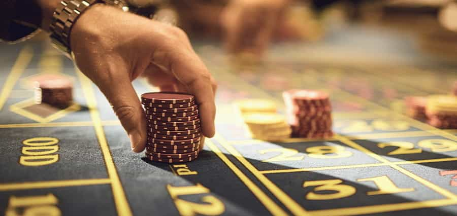 Man putting chips on a table