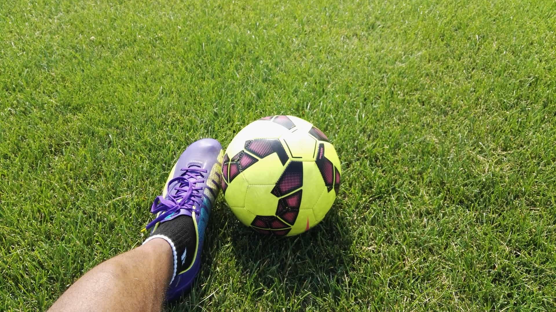 A football being kicked on the field