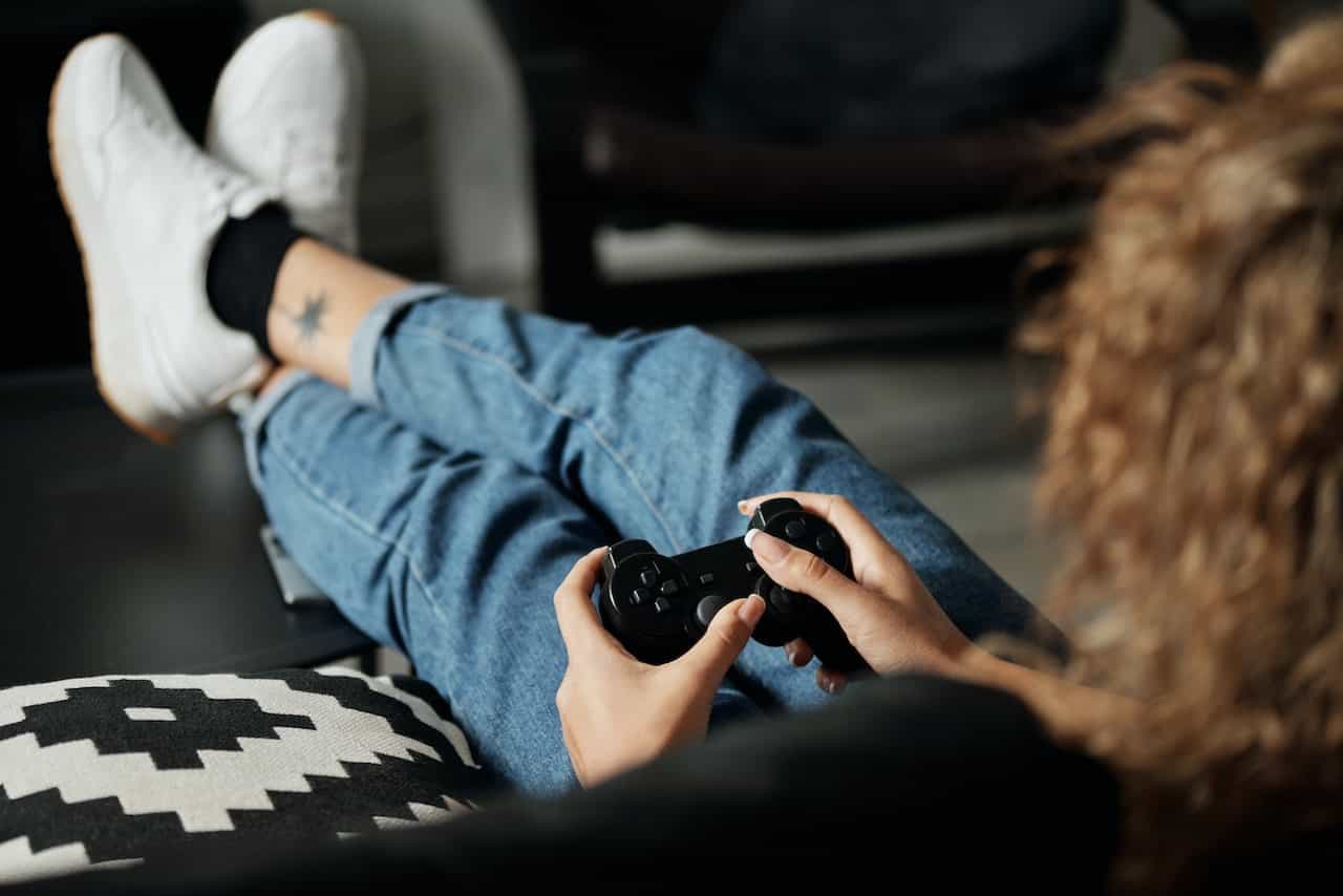 A woman holding a video game controller.