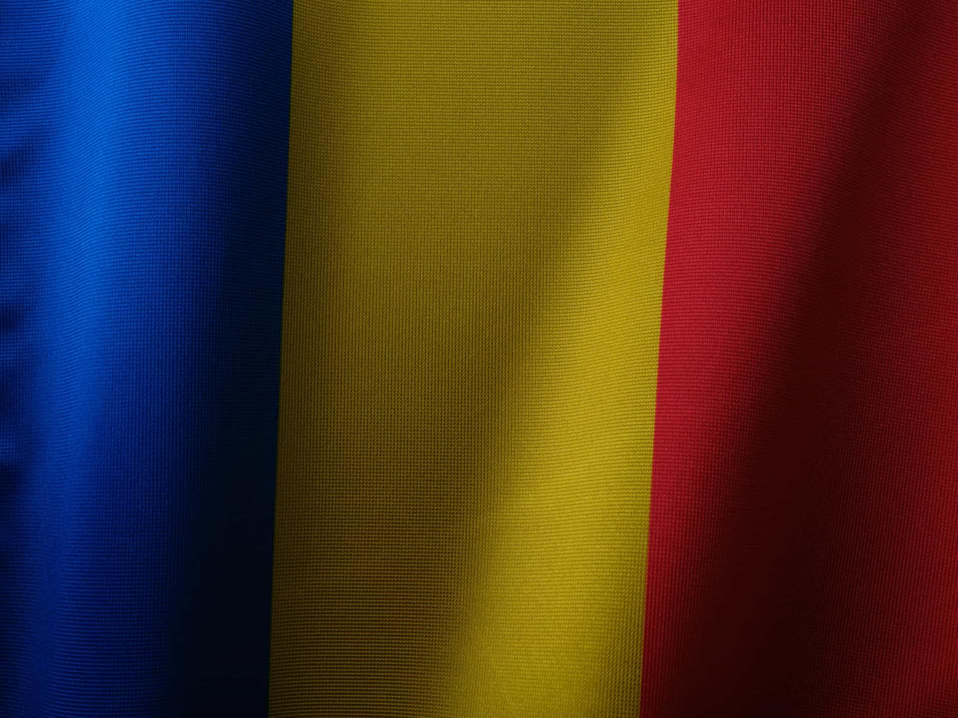Close up of a blue, yellow, and red flag.