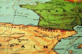 A shallow focus image of Spain on a world map.