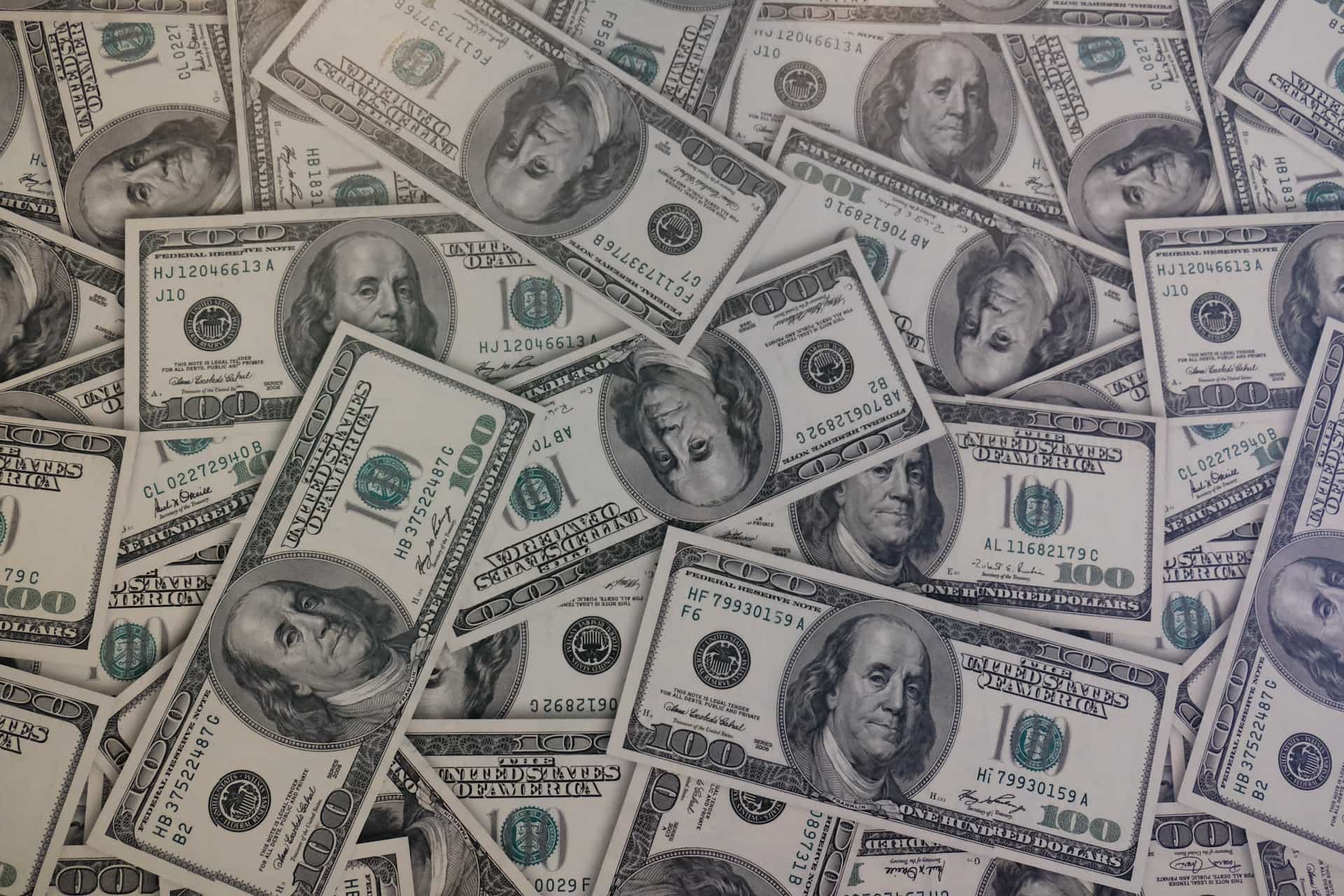 US dollars spread across a flat surface.