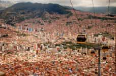 Four cable cars run over the city of La Paz, Bolivia.