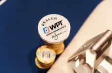 WPT branded poker chips and a dealer button.