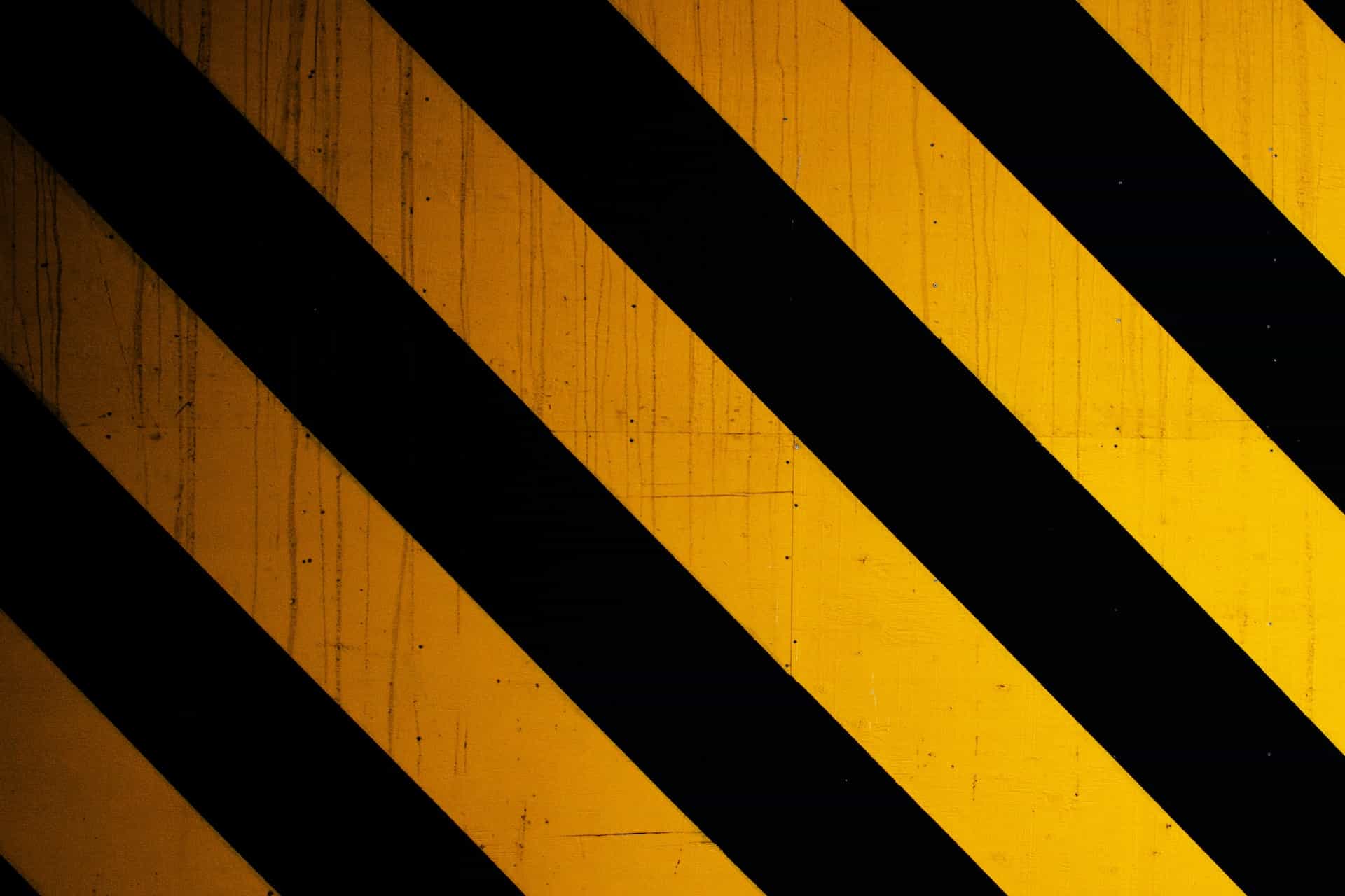 Yellow and black striped diagonal lines in a warning pattern.