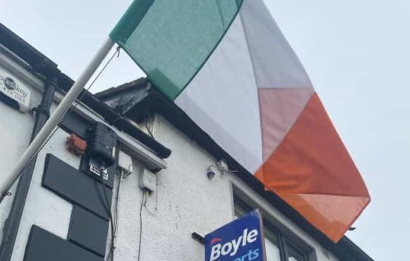 An Irish flag flies outside a BoyleSports betting shop.
