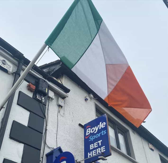 An Irish flag flies outside a BoyleSports betting shop.
