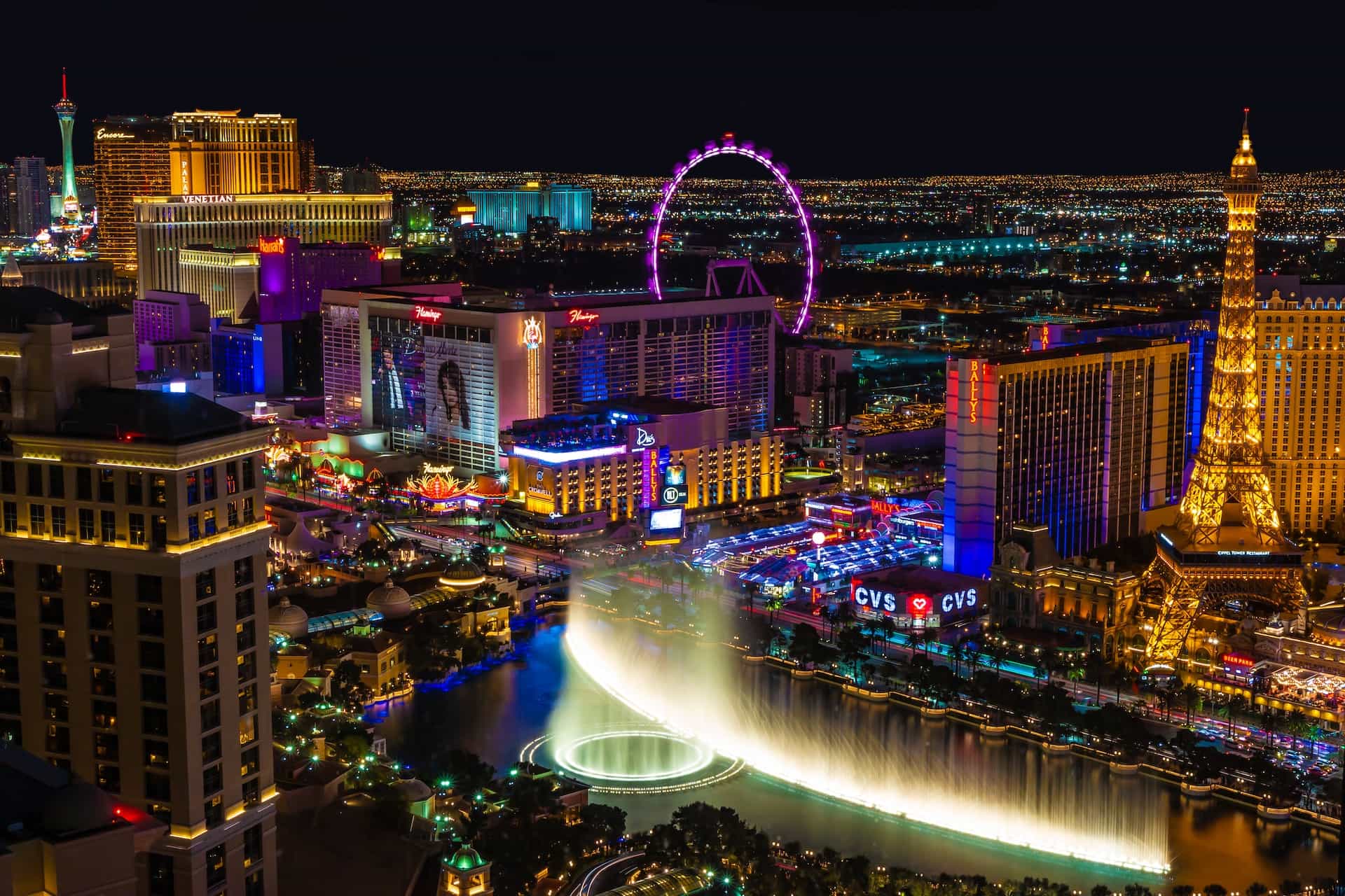 The world-famous “strip” in downtown Las Vegas, Nevada, featuring dozens upon dozens of luxury casinos and hotel resorts, as well as a giant ferris wheel.