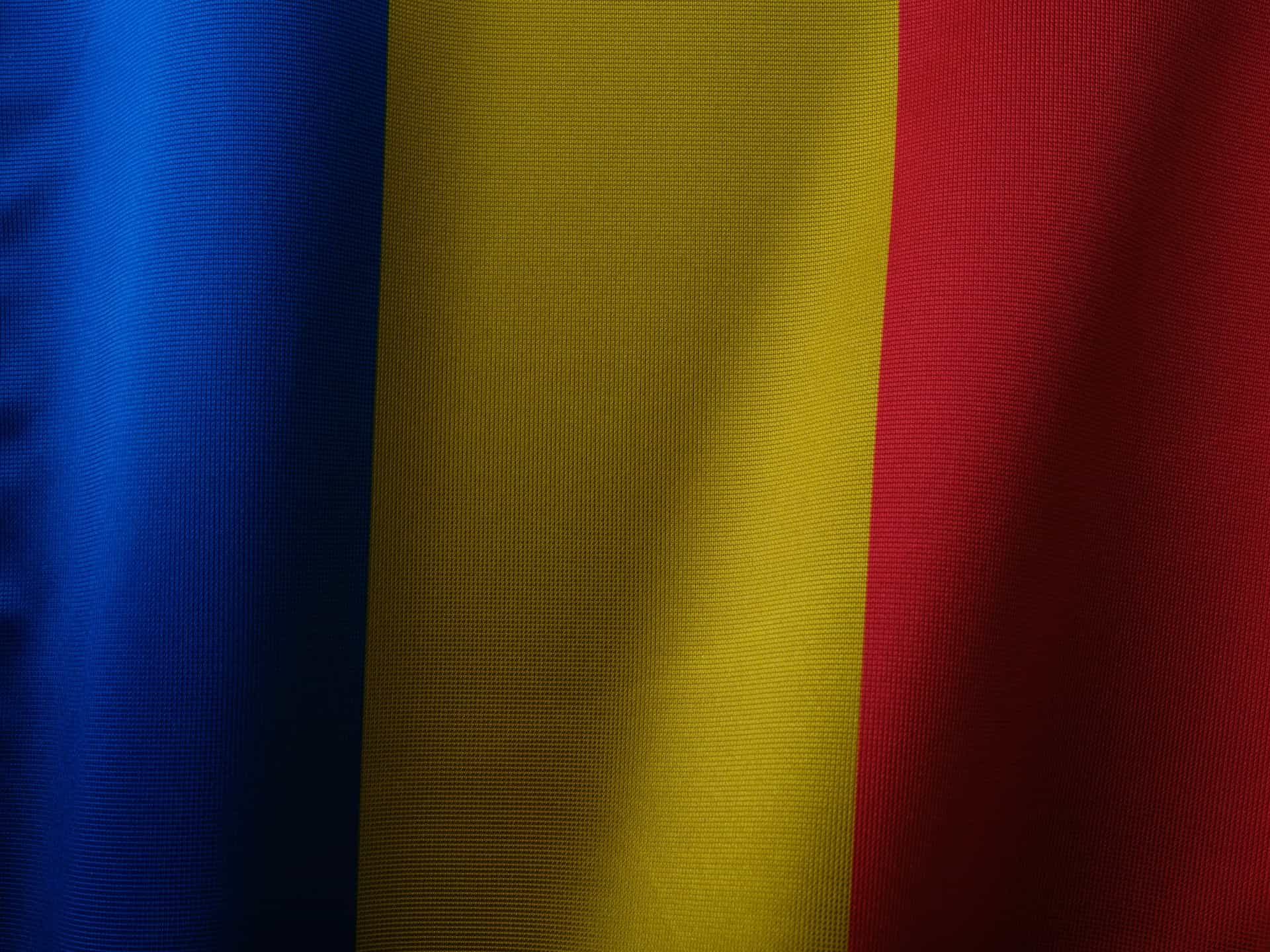 The image of a blue, yellow, and red flag.