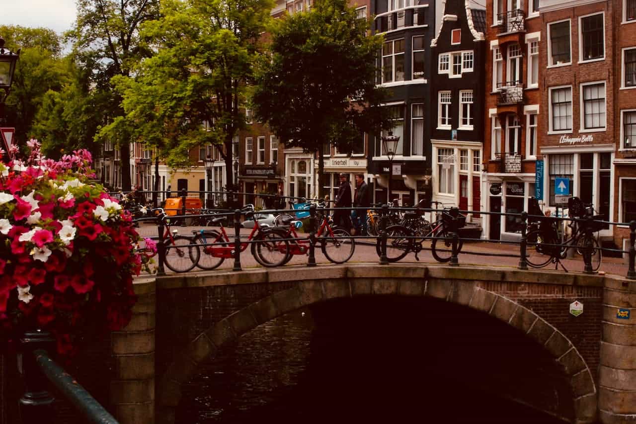 Bicycles parked on a bridge.