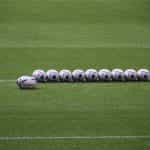 Rugby balls on the field.