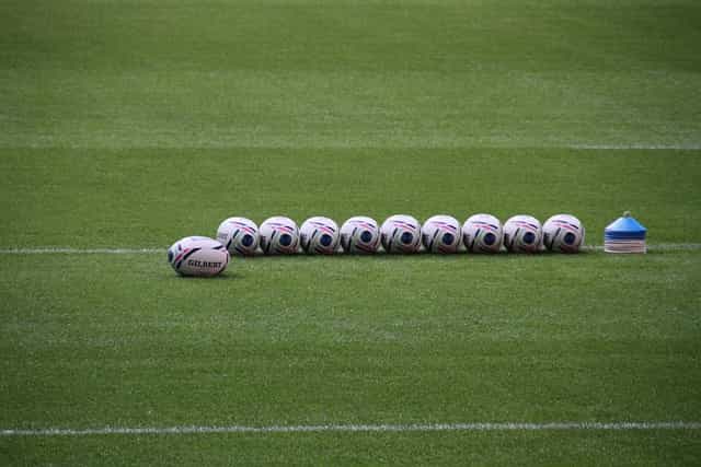 Rugby balls on the field.
