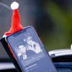 A mobile phone showing Wham’s Last Christmas on its screen.