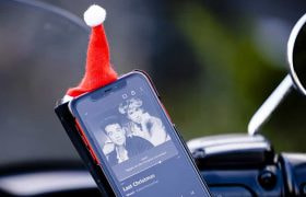 A mobile phone showing Wham’s Last Christmas on its screen.