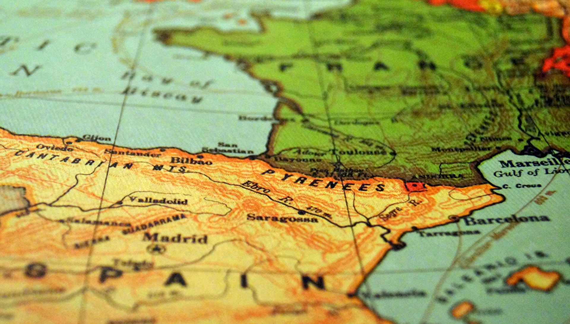 A close-up photo of a globe, focusing on Spain and Portugal.