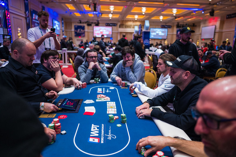 Players around a table at the 2023 WPT World Poker Championship in Wynn Las Vegas.