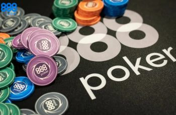 Chips and cards stacked on an 888poker branded poker table.