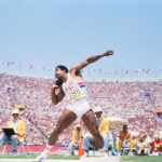 Daley Thompson putting the shot during the decathlon at the 1984 Olympic Games.